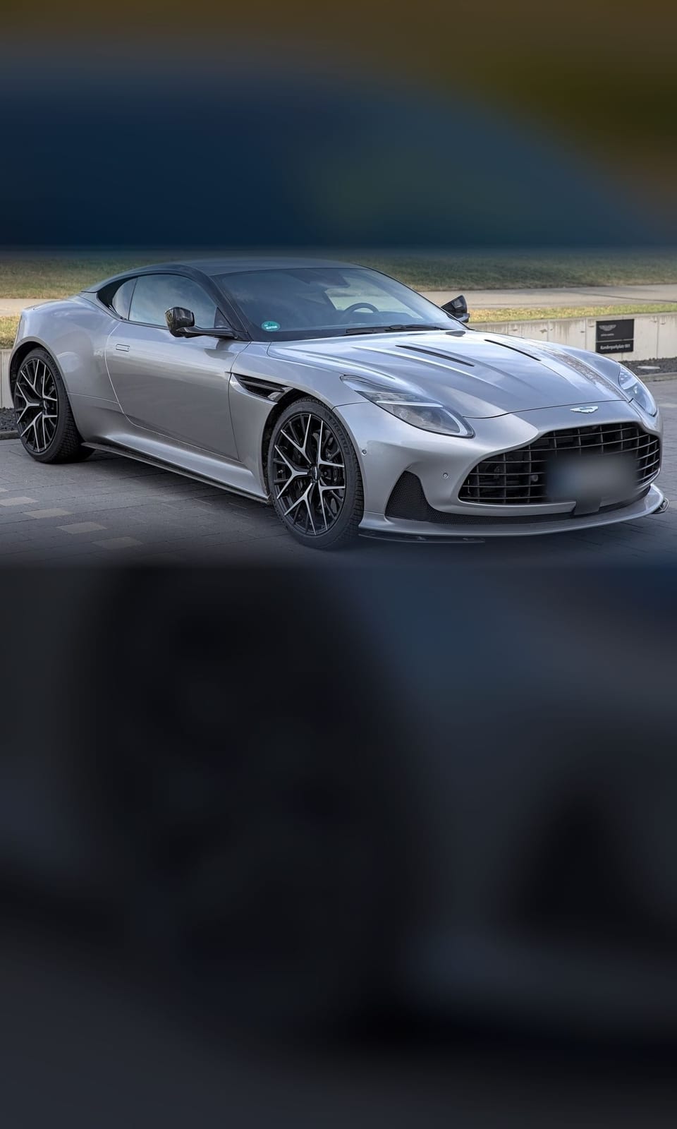 Silver Aston Martin DB12 coupe, front three-quarter view